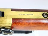 a close up of a rifle with a brass plate on it