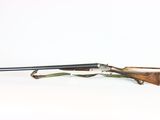a rifle with a wooden barrel on a white background