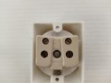 a close up of a white electrical outlet on a wall