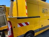 a yellow van that is parked in the parking lot