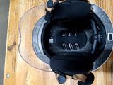 a helmet that is sitting on a wooden table