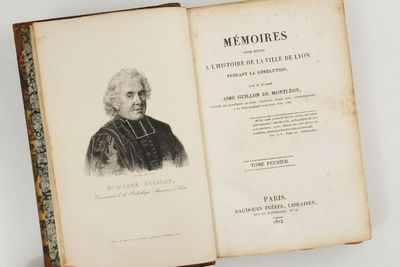 an old book with a picture of a man in a black coat