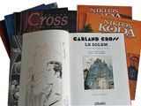 a lot of books that are sitting on a table