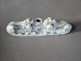 a picture of a sculpture of three monkeys on a skateboard