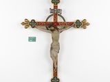 a close up of a wooden cross with a cross on it