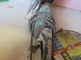 a picture of a drill on the floor in a room