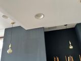 several lights hanging from the ceiling in a room