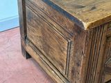 a wooden chest with a drawer on top of it