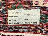 a close up of a rug with a tag on it