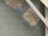 a close up of a piece of wood with a piece of rock in it
