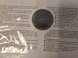 a piece of paper that has a picture of a coin on it