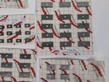several pieces of paper with red and black designs on them