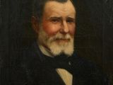portrait of an old man with a white beard and a bow tie