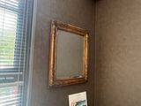 a picture of a bathroom with a toilet and a mirror