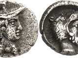 a silver coin with an image of a man and a woman on it