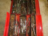 many tools in a red box on the floor