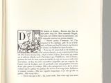 an open book with a black and white drawing of a man on a horse