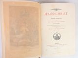 an open book with a picture of jesus christ on it