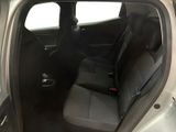 the back seat of a silver car with a black seat belt