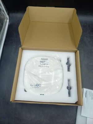 a box with a white cable in it on a table