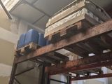 a large stack of boxes on a pallet in a warehouse