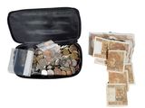 a black case filled with coins and notes on a white background