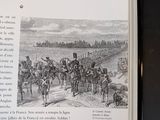 an open book with a picture of soldiers on it