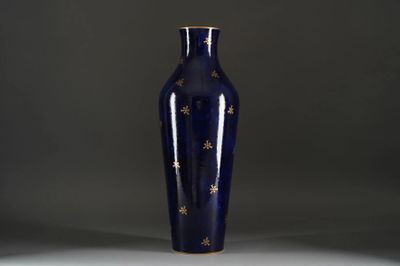 an image of a blue vase with gold stars on it