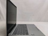 an open laptop computer sitting on top of a white table