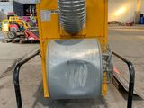 a machine that is sitting inside of a building in a warehouse