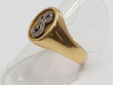 an image of a gold and diamond ring on a clear glass