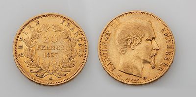two gold sovereigns, one with the head of a man and the other of a woman