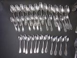 a lot of silver spoons and spoon spoons on a table