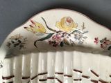 a plate with a floral design on it on a table