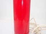 an image of a red table lamp on a white surface