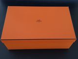 an orange box sitting on top of a black table