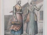 two women with baskets of food standing in front of a building