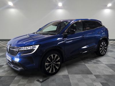 a blue suv parked in a garage with a checkered floor
