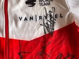 the jacket is red and white with black writing on it