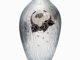 a glass vase with a black and white design on it