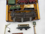 a box with a train set in it on a white surface