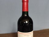 a bottle of wine that is sitting on a table