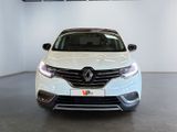 the front view of a white car parked in a garage