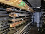 a large stack of steel bars stacked on top of each other
