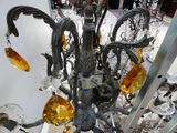 a glass chandelier with a lot of glass hanging from it
