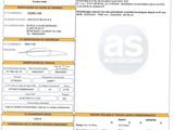 un gros plan d'un document sur lequel figure la photo d'une voiture