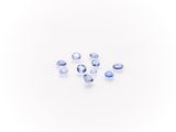 a group of blue sapphires on a white surface