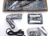 a box with a keyboard, mouse, and other items in it