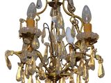 a chandelier that has a lot of lights hanging from it