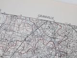 a map of the city of granville on the wall
